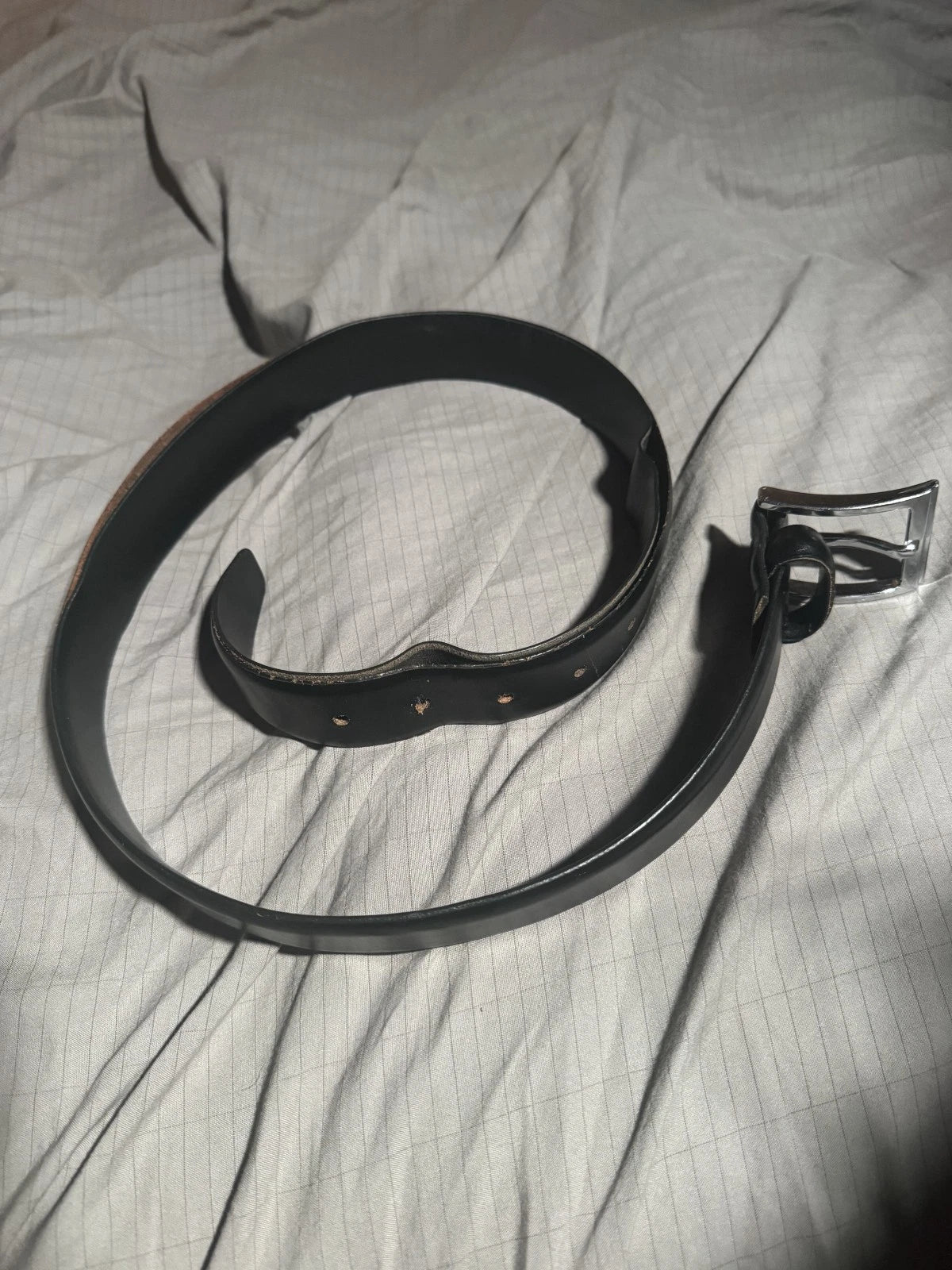 Vintage black belt with silver metal buckle