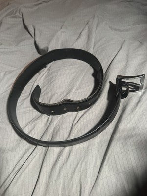 Vintage black belt with silver metal buckle