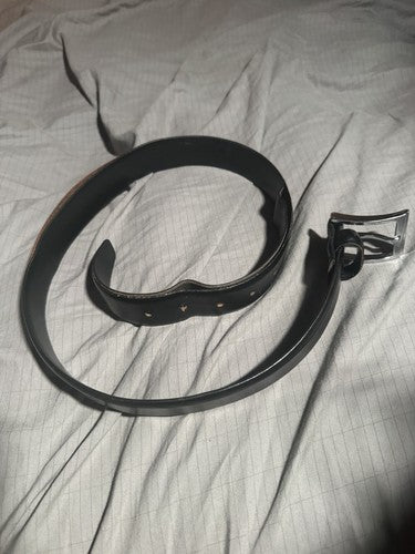 Vintage black belt with silver metal buckle